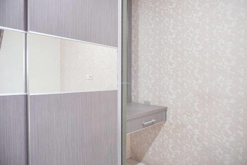 Good Deal and Relaxing 2BR Green Pramuka City Apartment By Travelio - Tap to explore photos