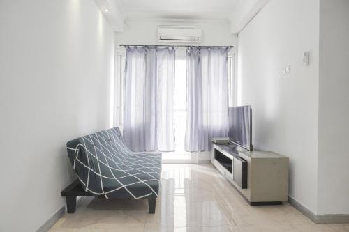 Nice and Cozy 3BR at Grand Palace Kemayoran Apartment By Travelio - Tap to explore photos
