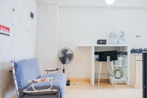 Nice and Spacious 2BR Green Pramuka City Apartment By Travelio - Tap to explore photos