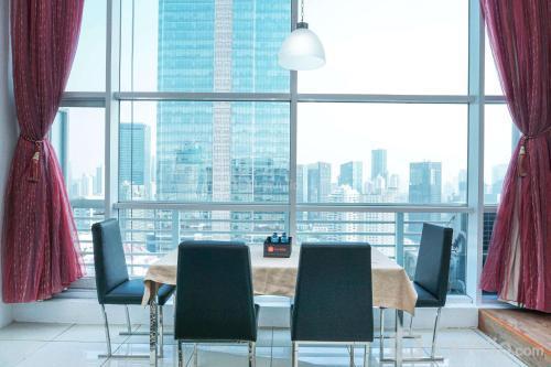 Elegant and Spacious 1BR Apartment at Citylofts Sudirman By Travelio - Tap to explore photos