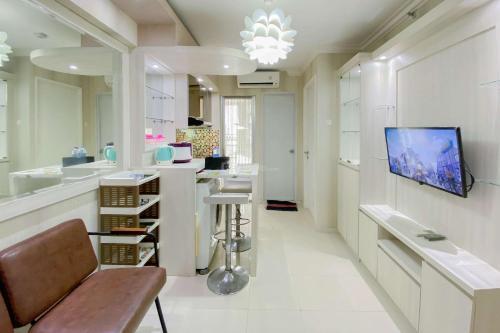 Comfortable and Homey 2BR at Bassura City Apartment By Travelio - Tap to explore photos