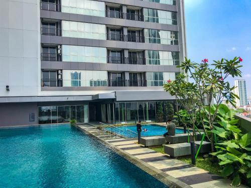 Nice Studio Apartment at Ciputra World 2 By Travelio - Tap to explore photos