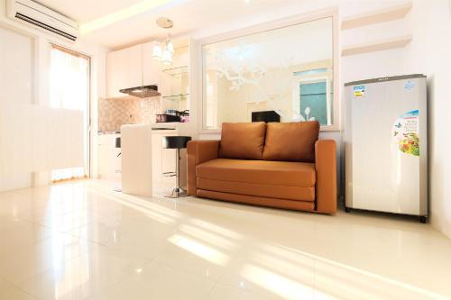 Cozy 2BR Bassura City Apartment with Mall Access By Travelio - Tap to explore photos