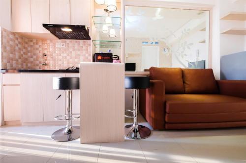 Cozy 2BR Bassura City Apartment with Mall Access By Travelio - Tap to explore photos
