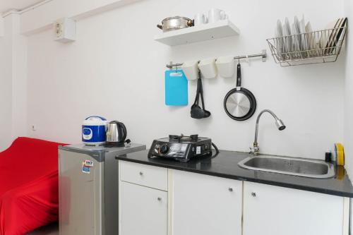 Comfy and Furnished 2BR Bassura City Apartment near Mall By Travelio - Tap to explore photos