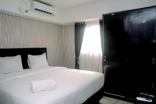 Homey and Relaxing 2BR The Wave Apartment By Travelio