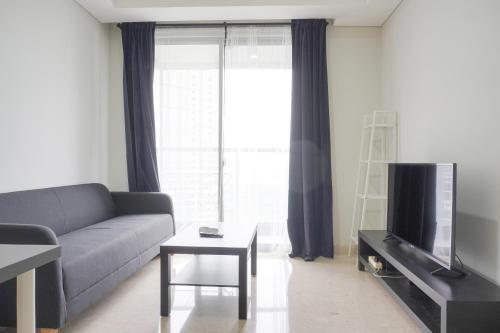 Nice and Homey 1BR at Gold Coast Apartment By Travelio - Tap to explore photos