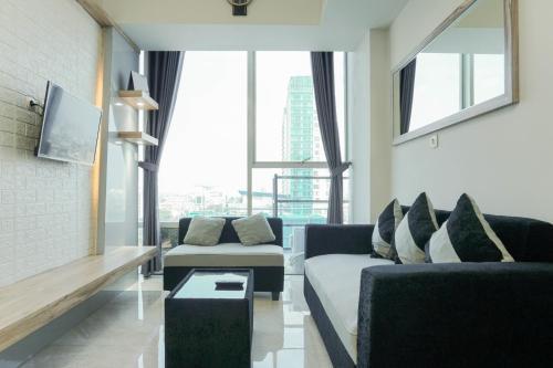 Fully Furnished with Comfortable Design 2BR Harco Mangga Besar Apartment By Travelio - Tap to explore photos