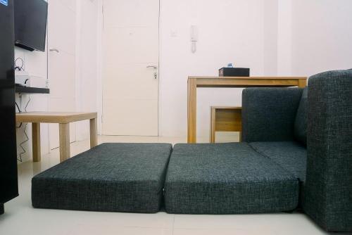 2BR Fully Furnished Minimalist Bassura City Apartment By Travelio - Tap to explore photos