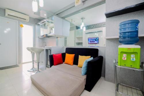 Comfy and Strategic 2BR Apartment at Bassura City By Travelio - Tap to explore photos