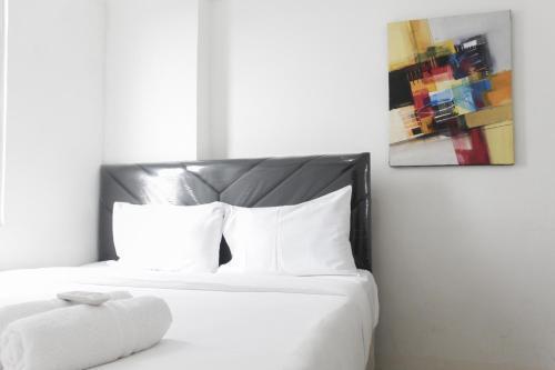 Minimalist and Enjoy 2BR at Bassura Apartment near Bassura Mall By Travelio - Tap to explore photos