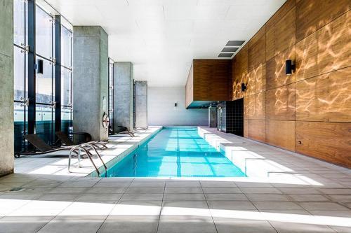A Chic 2BR Home Near Southern Cross City Views - Tap to explore photos