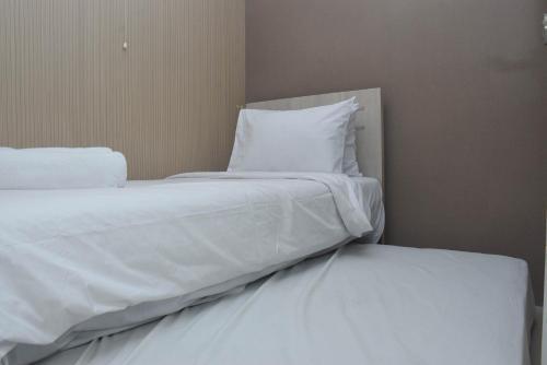 Comfortable 2BR Apartment at Bassura City By Travelio