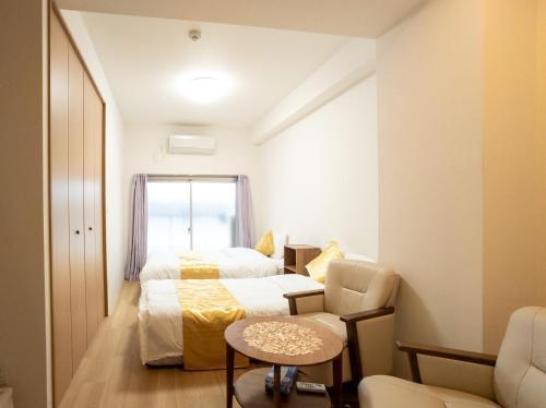 格安民宿 日暮里駅から徒歩4分 銀座 上野直通 Room Type - Deluxe Double Room with Two Double Beds