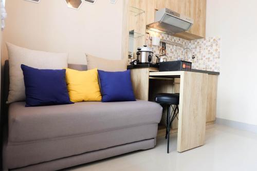 Modern and Bright 2BR Green Pramuka Apartment By Travelio - Tap to explore photos