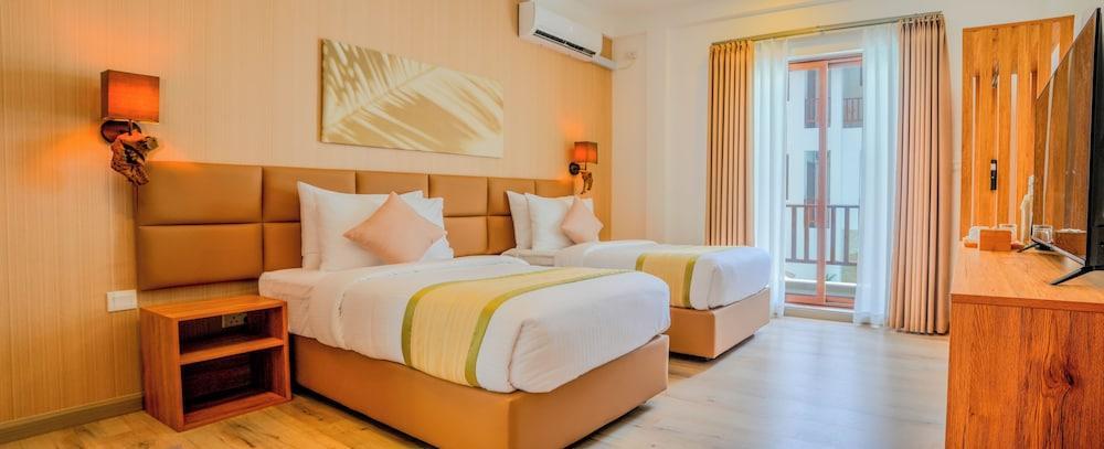Cocomo Maldives Room Type - Deluxe Double Room with Private Balcony Cocomo Maldives Room Type - Deluxe Double Room with Private Balcony