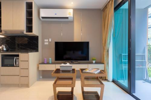 Panora Surin by Holy Cow, 1-BR, courtyard view - Tap to explore photos