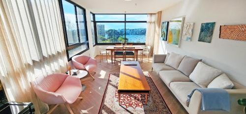 Beautiful harbour views, stylish apartment & pool - Tap to explore photos