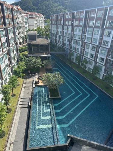 Dcondo mine Swimming pool view - Tap to explore photos
