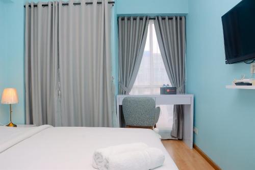 Relaxing Studio at Tifolia Apartment By Travelio