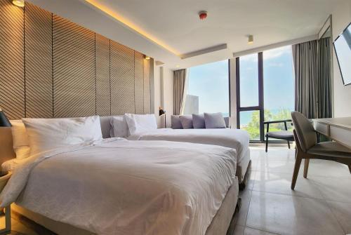 Howard Johnson by Wyndham Pattaya JC Room Type - Superior Twin Room with Ocean View - Non-Smoking