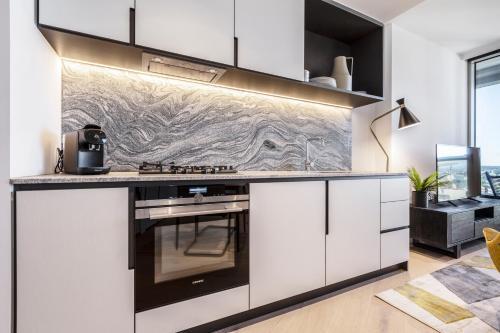 West Side Explore Downtown Melb in Chic Condo - Tap to explore photos