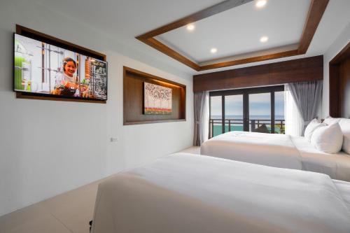 Anona Sunset Boutique Room Type - Deluxe Triple Room with Ocean View