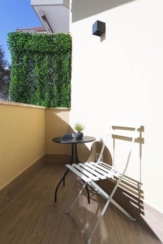 GENESI Suites - Tap to explore photos