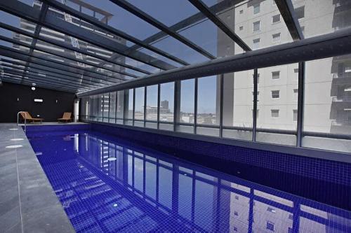 Comfy & Stylish 2BR Apt Next to Crown, City Views - Tap to explore photos