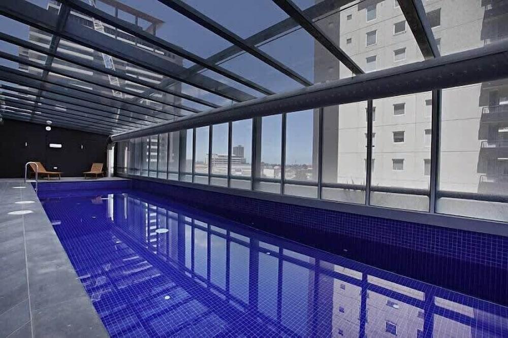 Comfy & Stylish 2BR Apt Next to Crown, City Views - Tap to explore photos