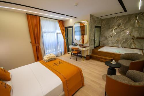 Elysian Airport Hotel & Restaurant Room Type - Deluxe Queen Room