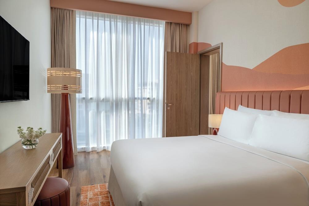 YAS PLAZA CIRCUIT by IHG - Theme Park Access Room Type - Family Suite, 1 Queen Bed with Sofa bed, Accessible (Plaza View, Family Room) YAS PLAZA CIRCUIT by IHG - Theme Park Access Room Type - Family Suite, 1 Queen Bed with Sofa bed, Accessible (Plaza View, Family Room)