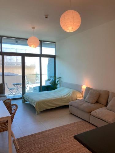 Fully furnished studio with balcony, shared infinity pool, gym and private parking - Tap to explore photos