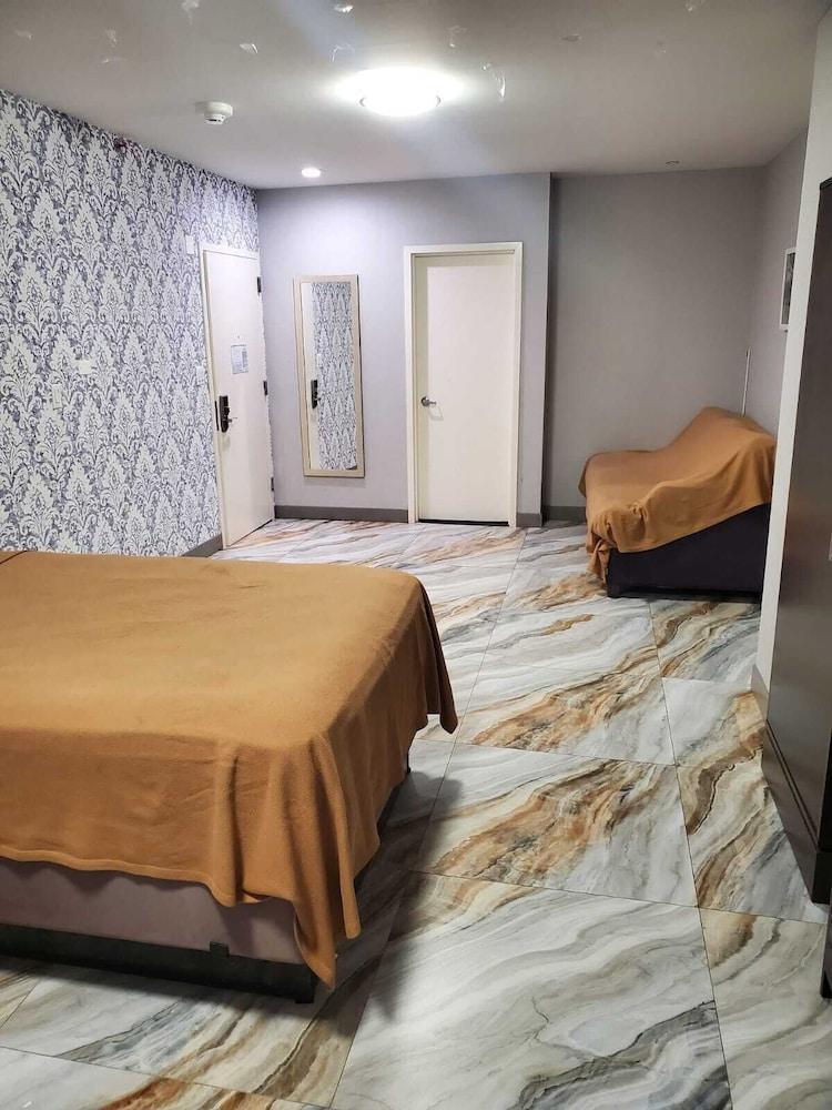 The Essence Hotel AT JFK - Tap to explore photos