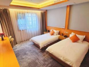 Qiletang Hot Spring Hotel - Tap to explore photos