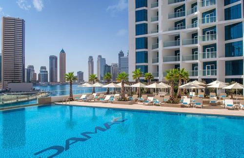 Damac Maison Prive Deluxe Studio with Water Canal View - Tap to explore photos