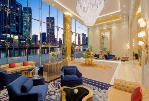 Damac Maison Prive Deluxe Studio with Water Canal View - Tap to explore photos