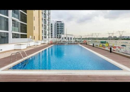 Yogi - Studio in Azizi Riviera - MBR City & Pool - Tap to explore photos
