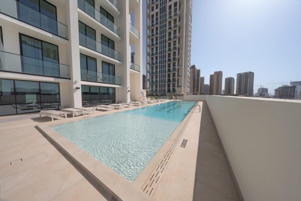 Luxury 1-bedroom JVC Apartment With Balcony Pool - Tap to explore photos