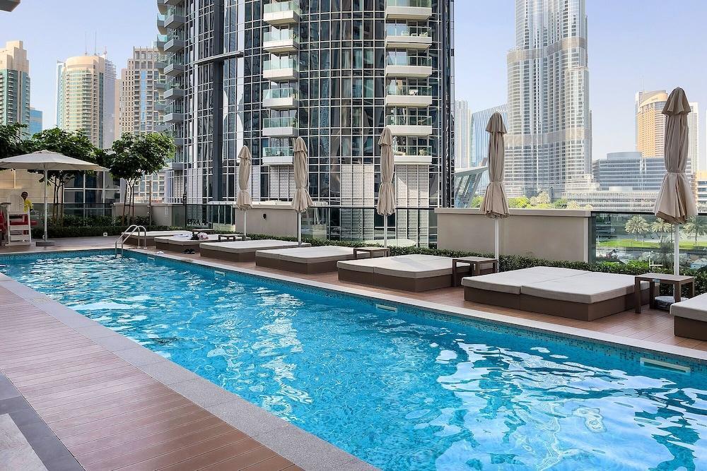 Luxury Burj Khalifa View 4BR - Tap to explore photos