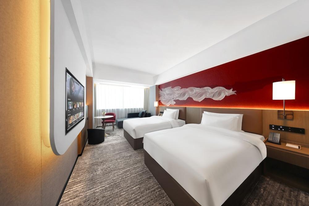 Huayu Wanfu Hotel - Tap to explore photos