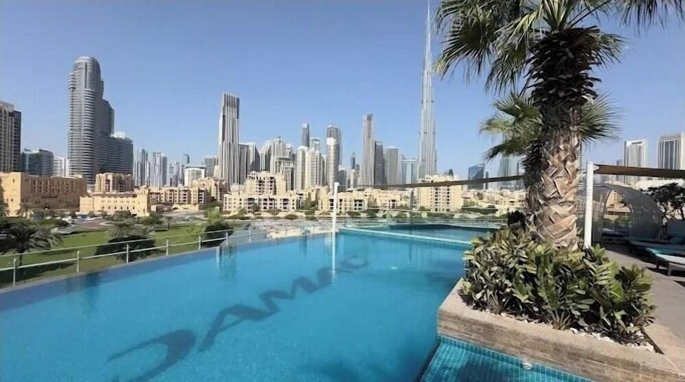 Elegant 1BR with Downtown & Burj Views - Tap to explore photos