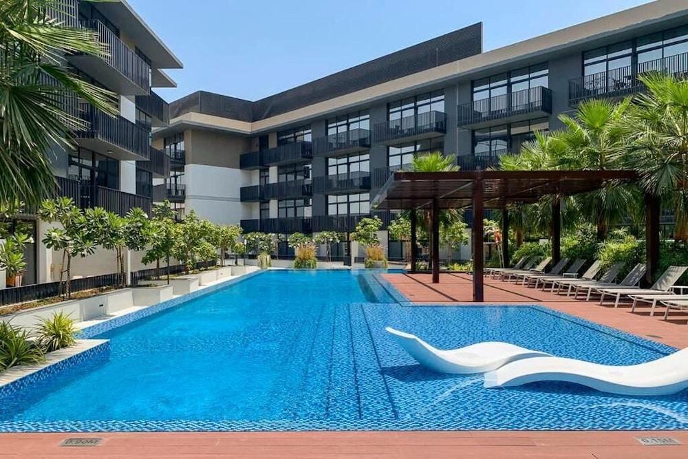 Manzil-1BR Apt with Pool in JVC - Tap to explore photos