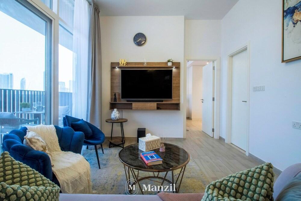 Manzil-1BR Apt with Pool in JVC - Tap to explore photos