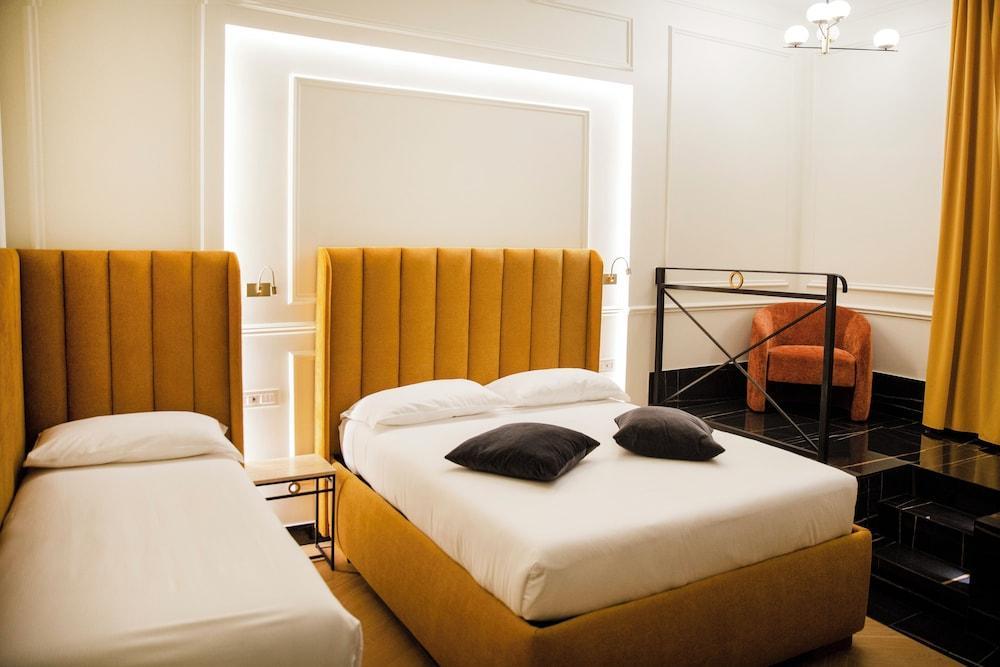 Unicum Trastevere Suites - Tap to explore photos