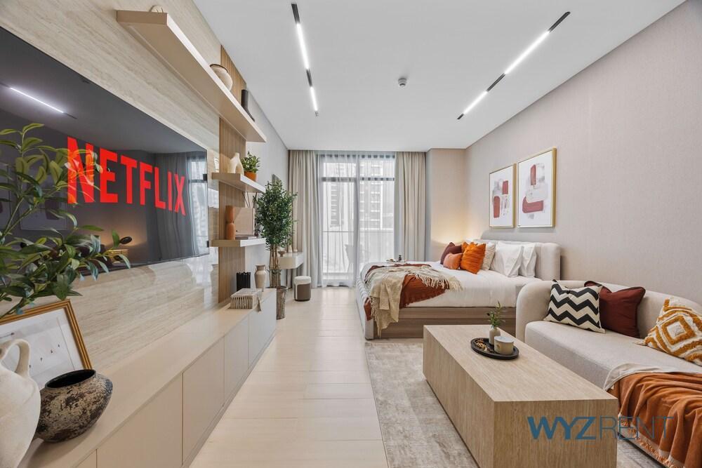 WYZ RENT|JVC Boho Grecian Studio Pool & Gym - Tap to explore photos