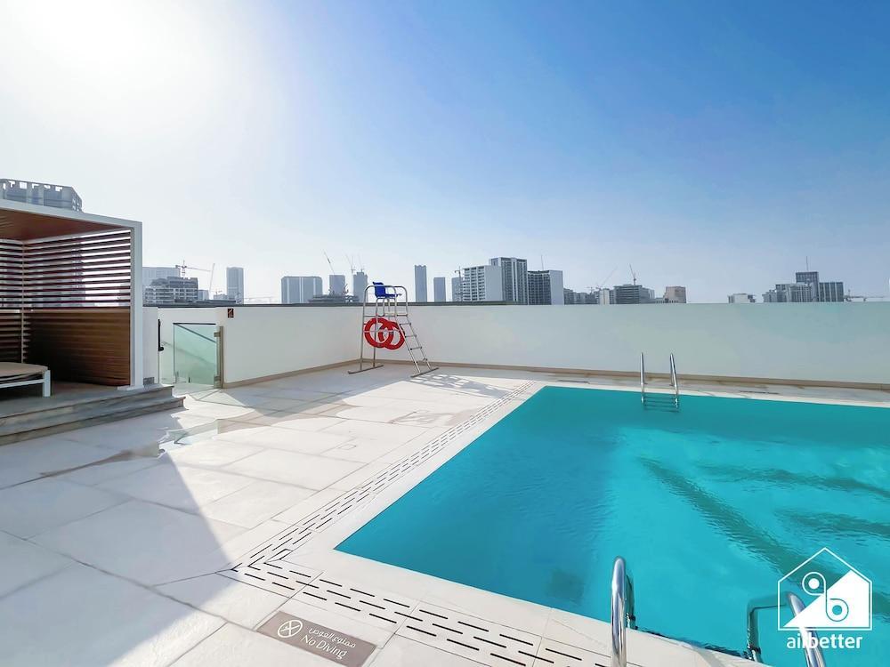 Luxury 1BR Balcony, Pool, Gym Prime Location - Tap to explore photos