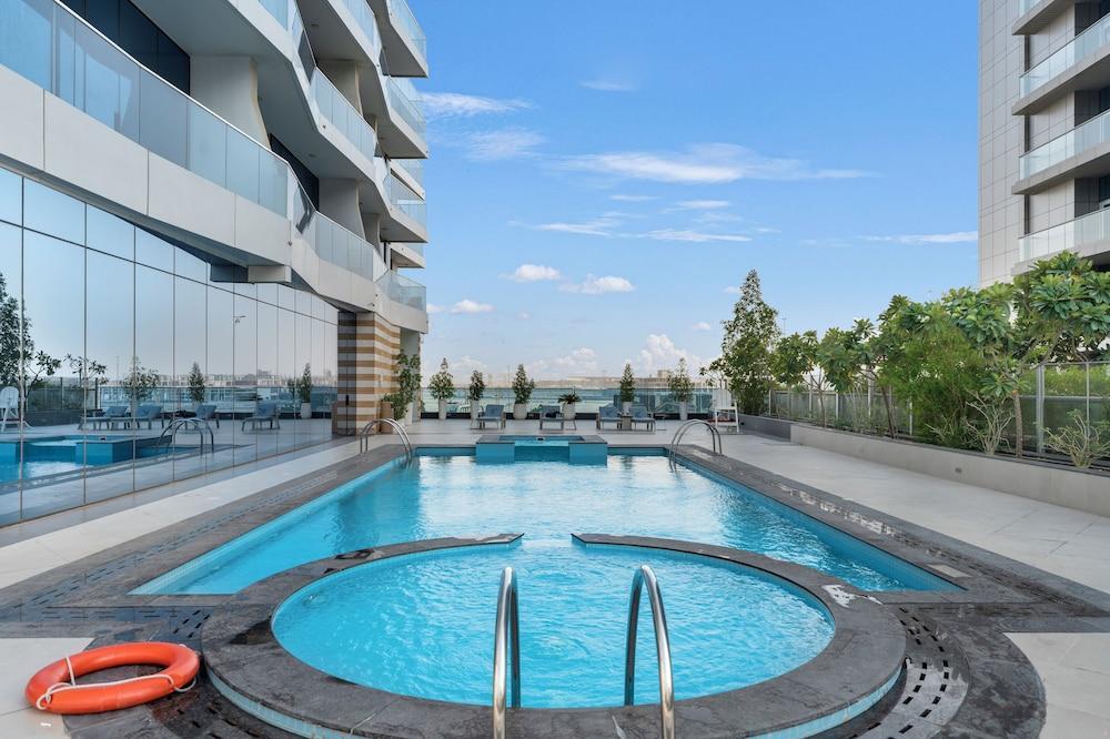 Chic 1BR Canal View at Waves Tower - Tap to explore photos