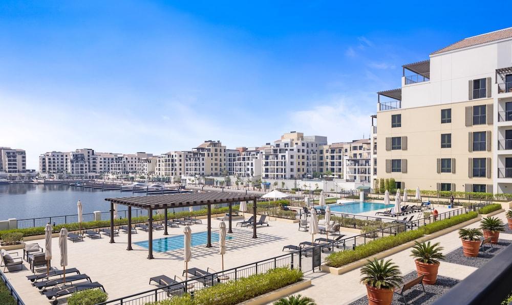 Boho Bayfront 1BR La Sirene Seaport View - Tap to explore photos