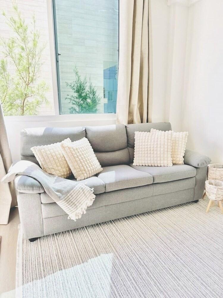 Lazzlla 1BR beachside oceanview apartment - Tap to explore photos